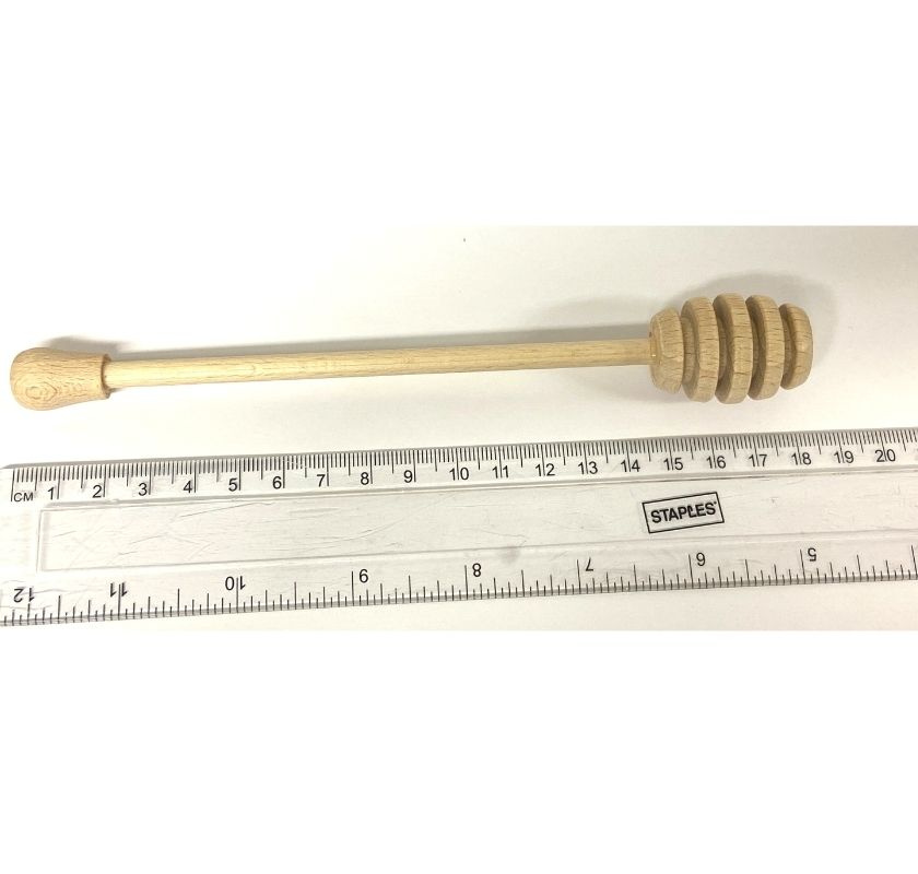 Honungsdroppare och linjal m�ter ca 18 cm