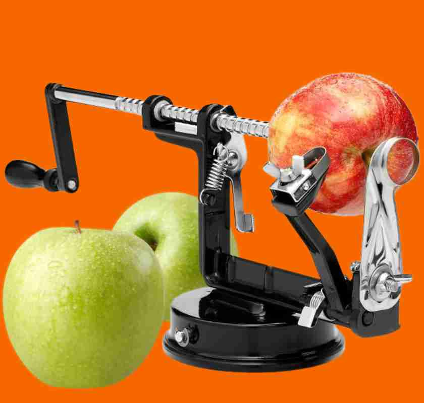 Svart �ppelskalare med gr�na och ett r�tt �pple mot orange