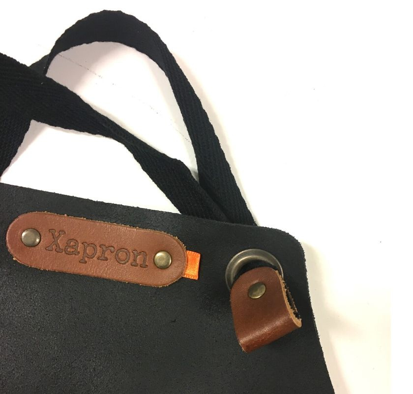 Svart f�rkl�de f�r barn i svart skinn Xapron