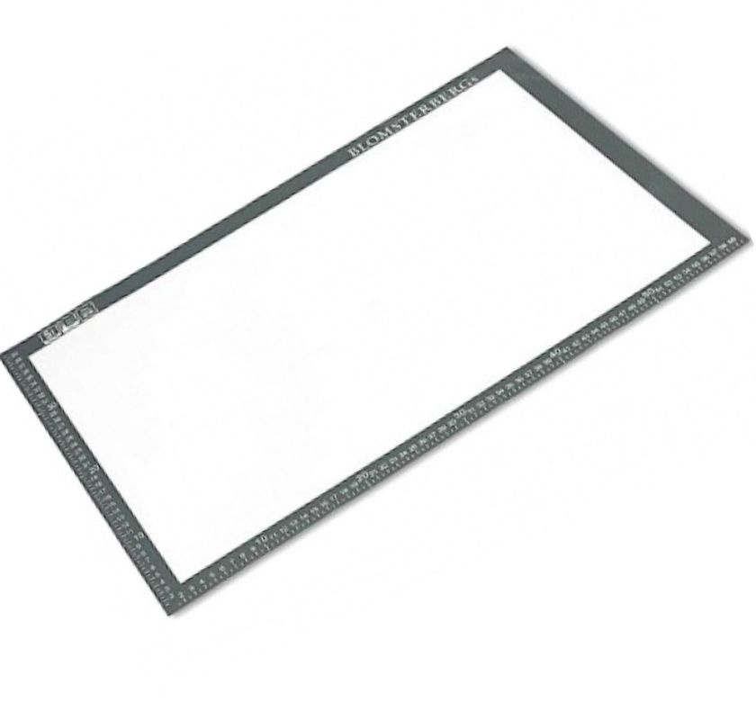 Vit bakmatta med gr� kant av silikon fr�n Blomsterberg