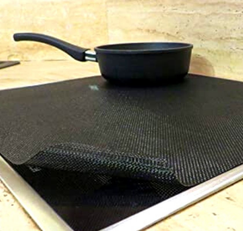 Skydd f�r induktionsspis, klippbart p� h�ll med kastrull