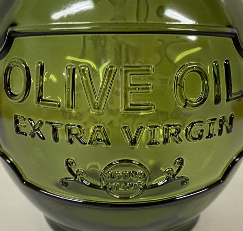 olivoljeflaska relief i glaset framsida