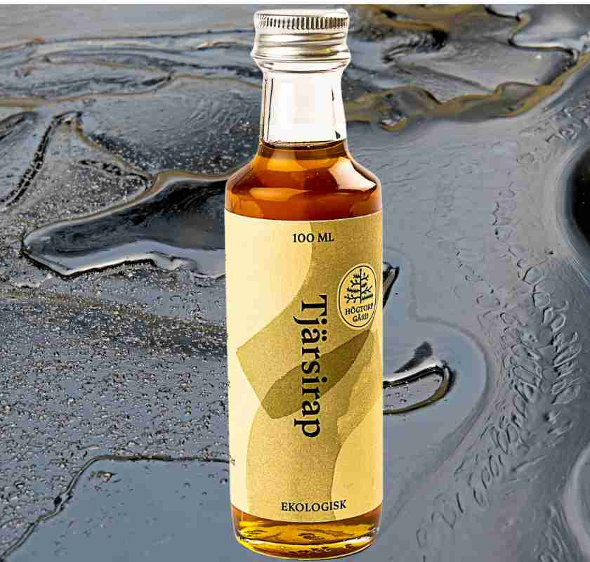 Tj�rsirap fr�n H�gtorp G�rd ekologisk med tj�ra i bakgrunden