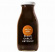 En flaska blackgarlicketchup från Halen Mon Glasflaska med svart vitlök ketchup, märkt med texten