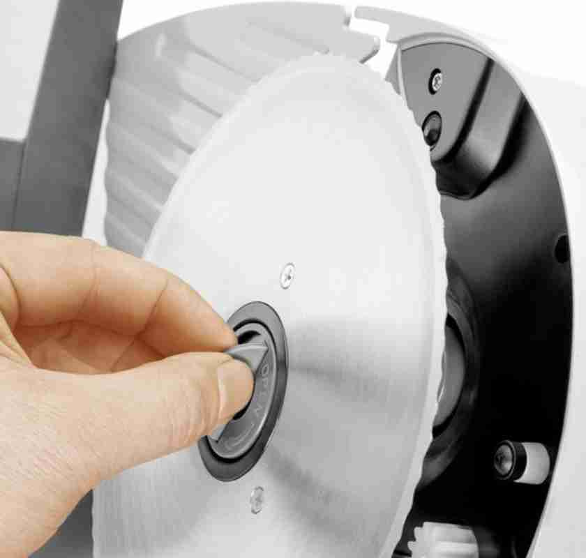 Tar bort sk�ret fr�n sk�rmaskin i rostfritt st�l