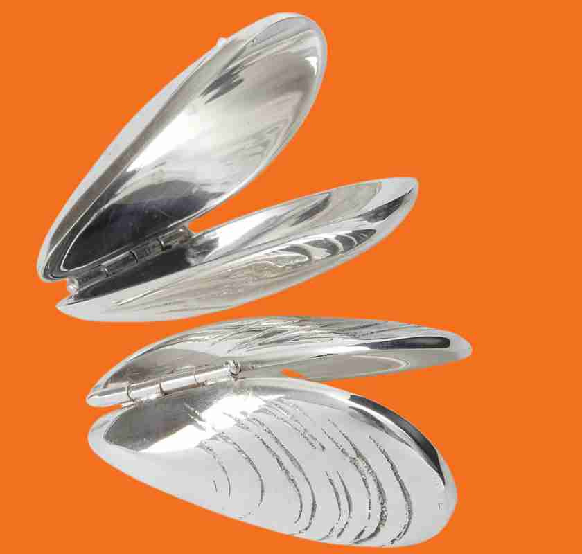 Musselbestick, mussel eaters fr�n Culinary Concepts 2 st frilagda mot orange bakgrund