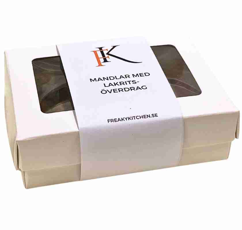 Mandlar med lakrits�verdrag i vit ask med f�nster