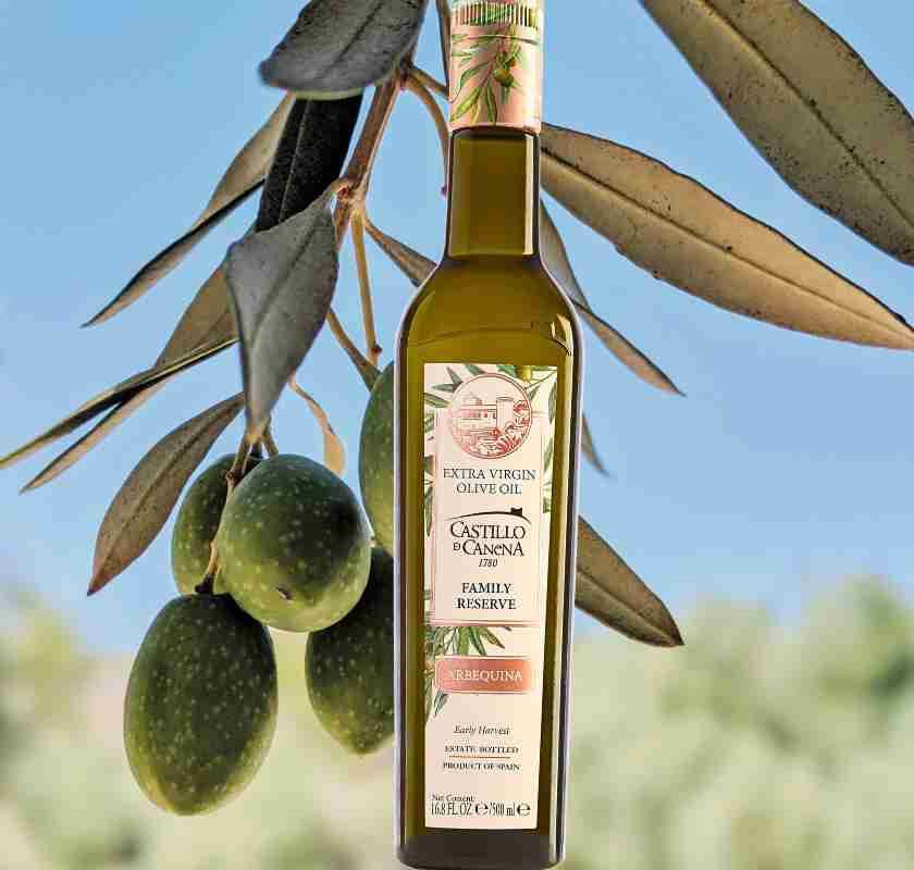 Olivolja Reserva Familiar Arbequina XV Castillo de Canena och olivkvis i bakgrunden